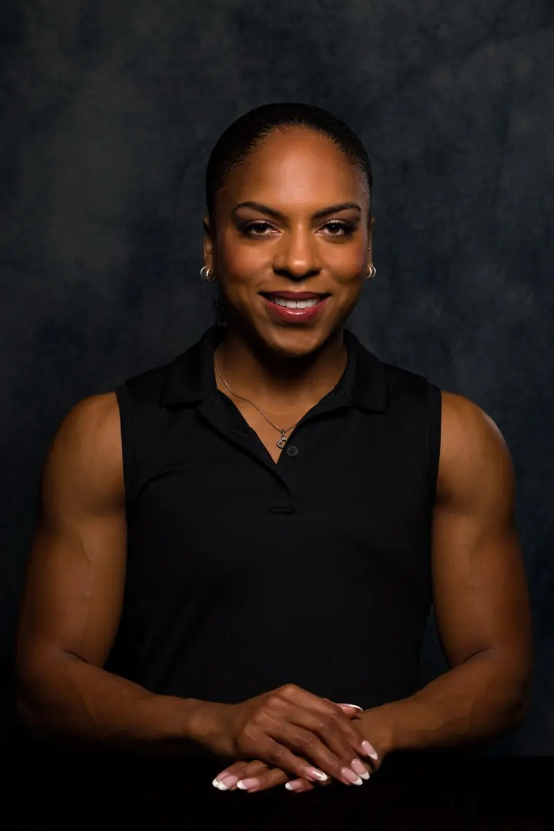 Portrait of confident woman with folded hands