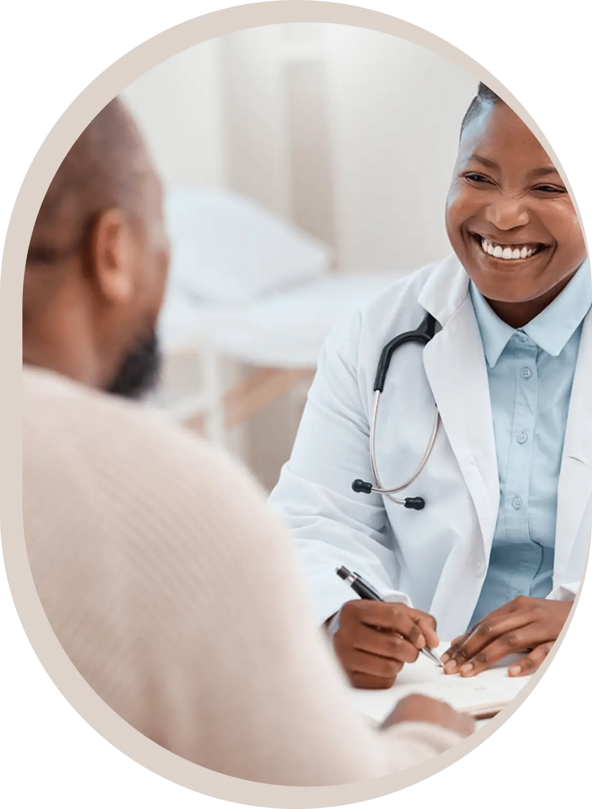 Doctor smiling during patient consultation.