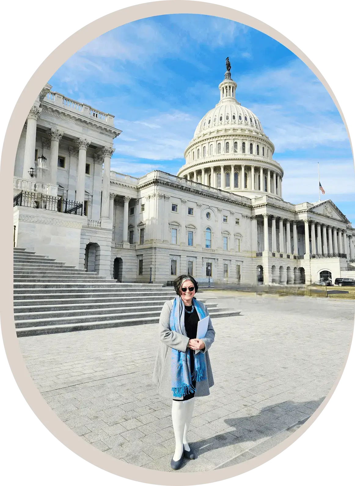 Person standing in front of the Capitol.