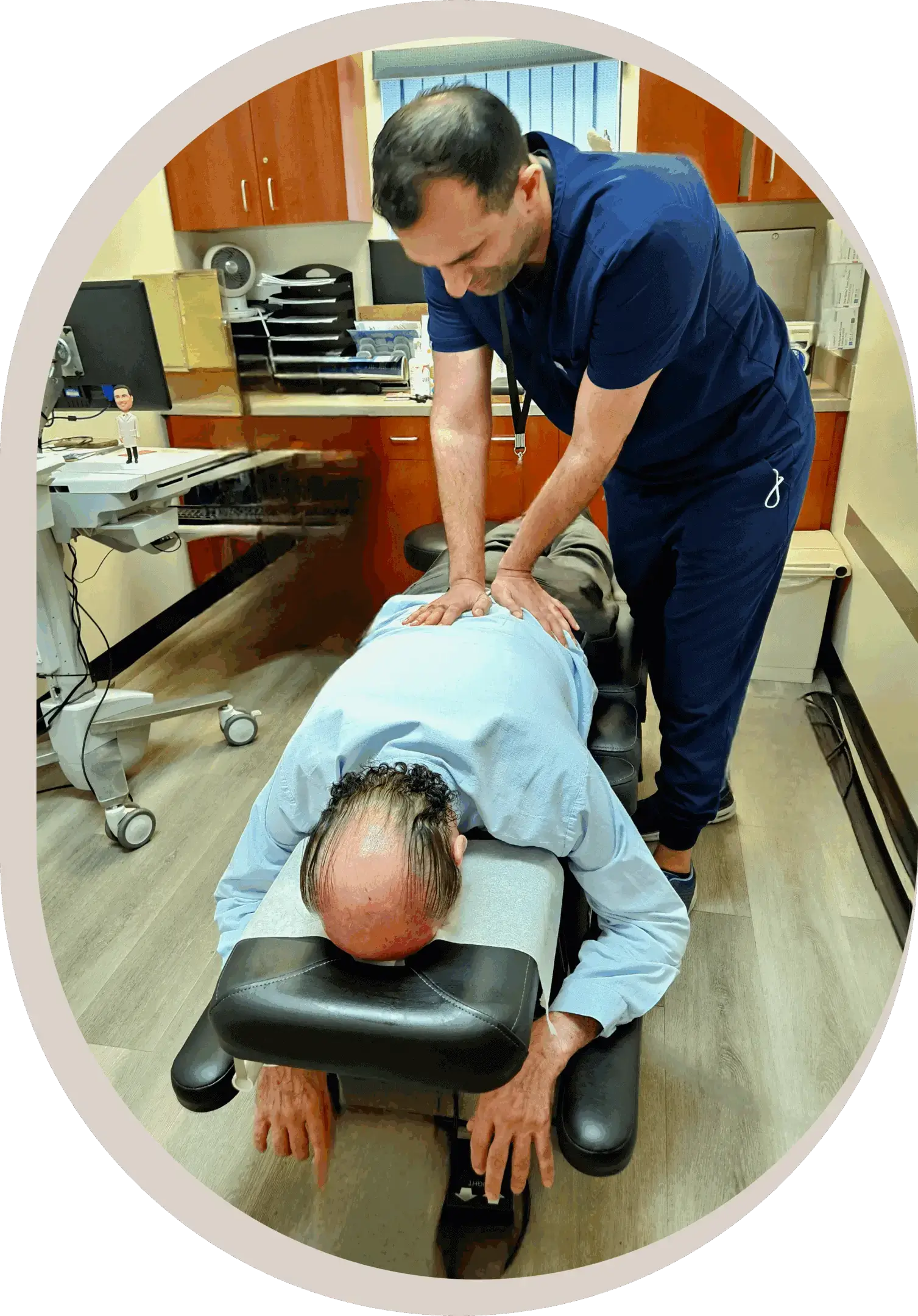 Chiropractor performing adjustment on a patients back.