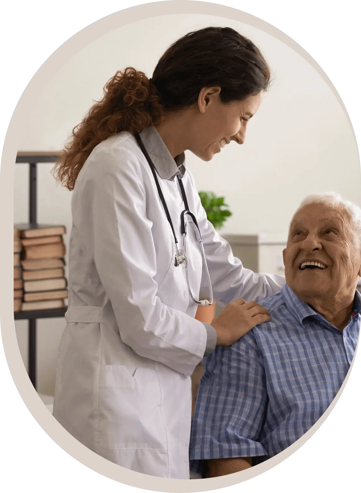 Doctor smiling with elderly patient in office.